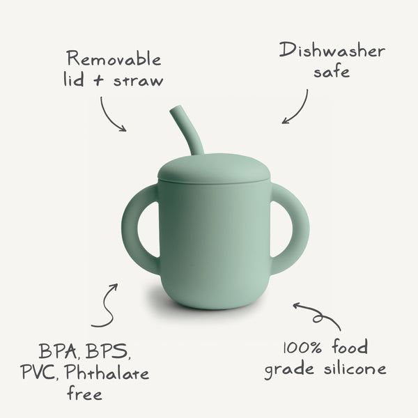 Silicone training cup with straw, angled view, perfect for toddlers learning to drink independently.