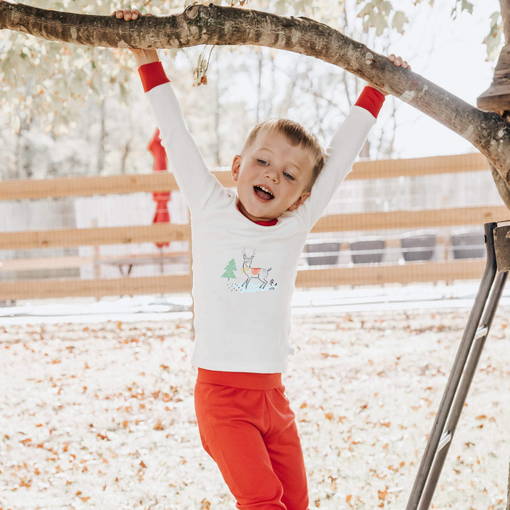 Cozy deer Christmas pajamas for babies, perfect for festive holiday sleepwear.