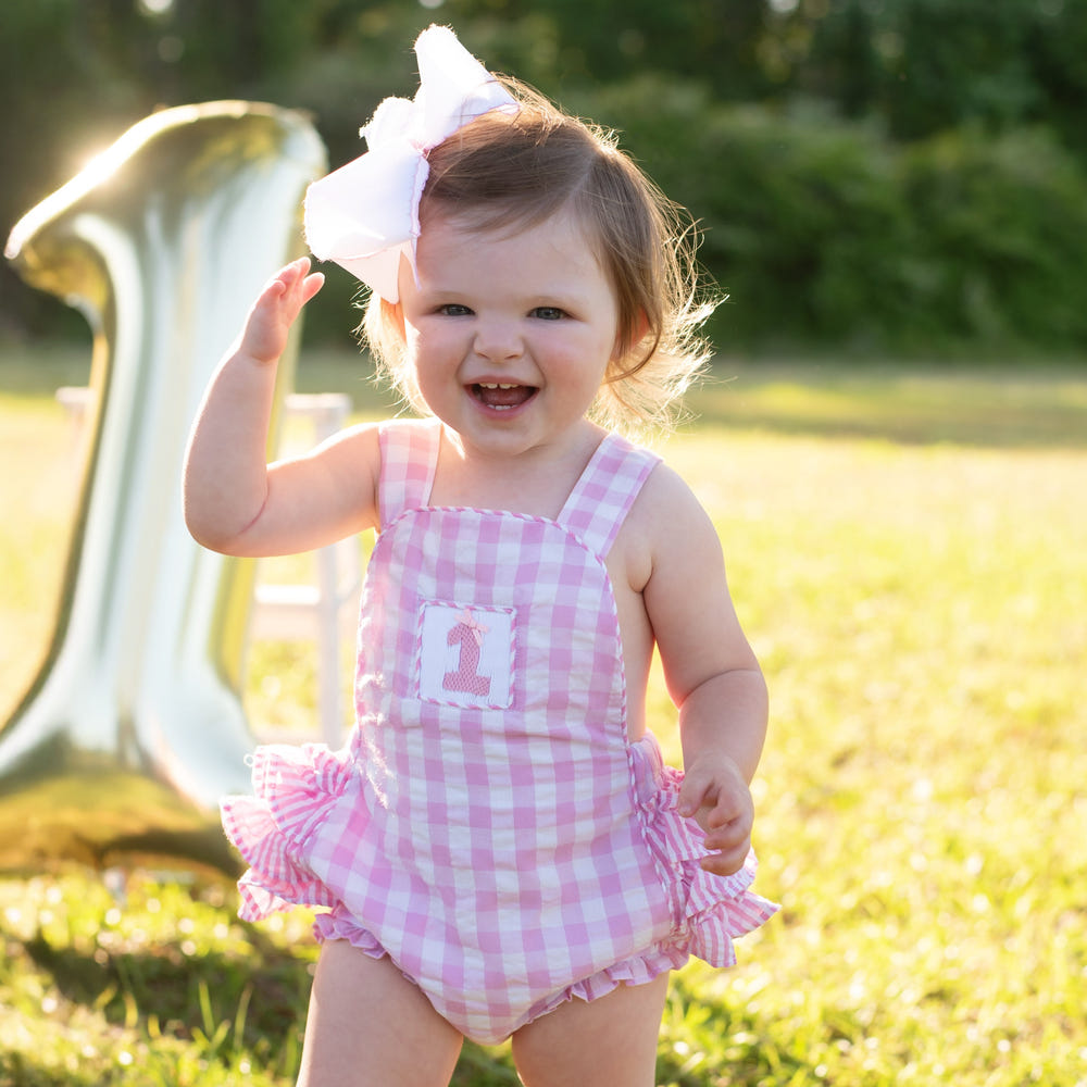 Pastel pink first birthday bubble for girls, perfect for celebrating a special milestone in style.