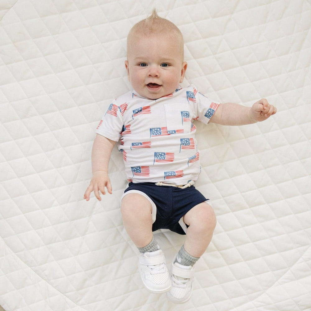 Navy blue bamboo track shorts for babies, soft and comfortable, perfect for playtime and casual outings.