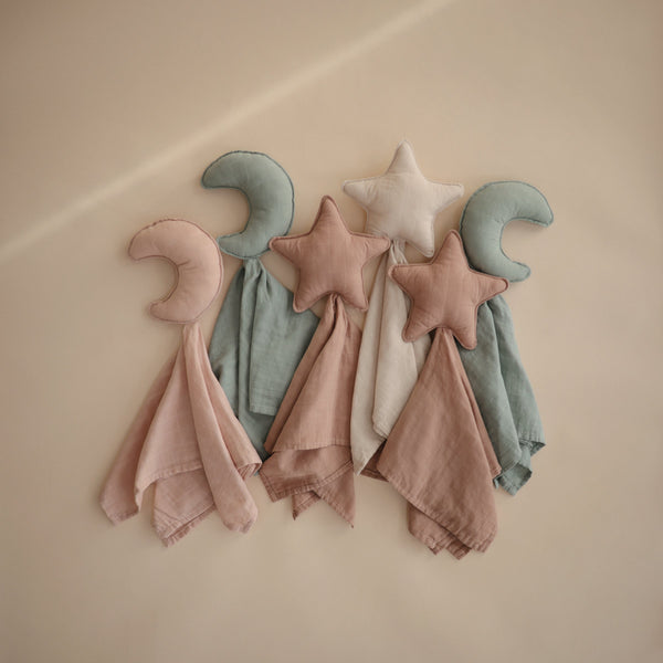 Moon Lovey Blanket in soft fabric, perfect for cuddling and comforting your baby. Angle view showcasing its adorable design.