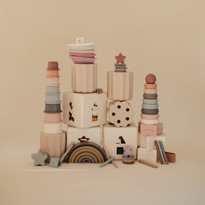 Colorful rainbow stacker toy for babies, showcasing vibrant rings in an angled view. Perfect for early learning and play.