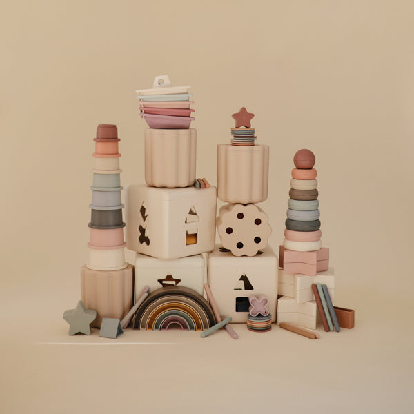 Colorful rainbow stacker toy for babies, showcasing vibrant rings in an angled view. Perfect for early learning and play.