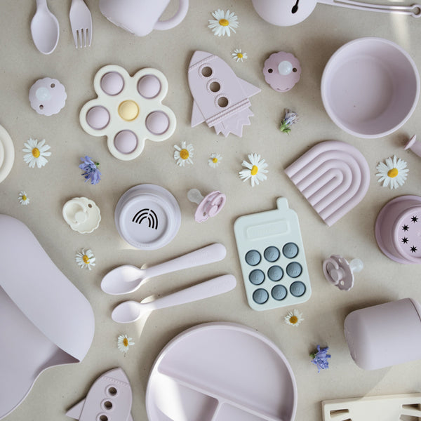 Colorful flower press toy for babies, showcasing vibrant petals at a 25-degree angle. Perfect for sensory play!