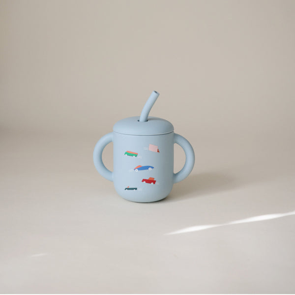Silicone training cup with straw, perfect for toddlers learning to drink independently. Angle 61 view.