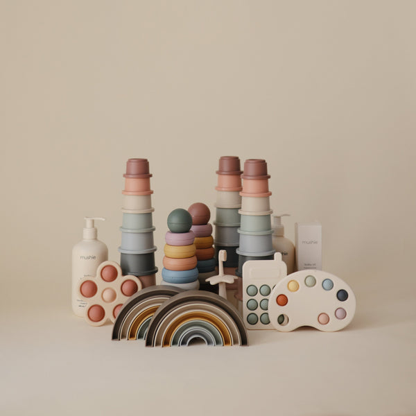 Colorful Rainbow Stacker Toy for babies, featuring vibrant rings in a playful design, perfect for early learning and fun.