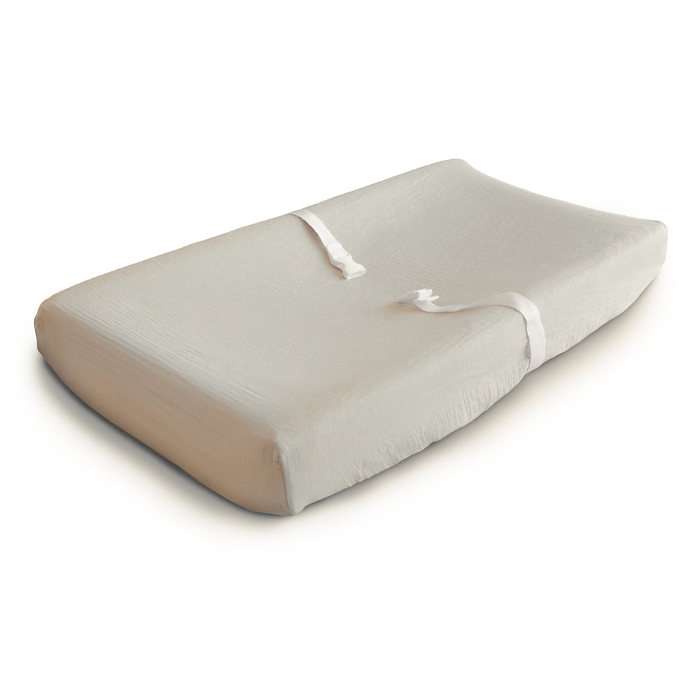Extra soft muslin changing pad cover in a soothing color, perfect for baby's comfort and style during diaper changes.