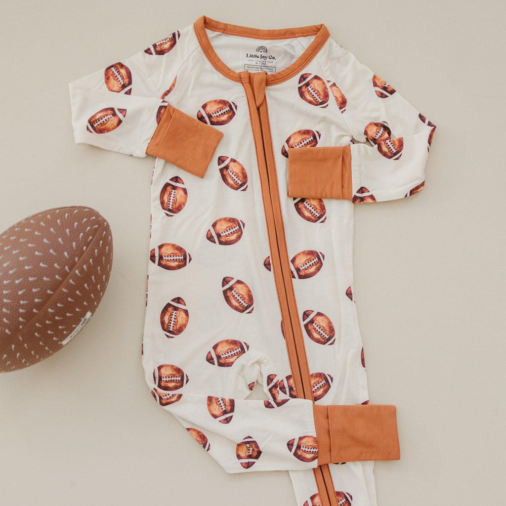 Football print bamboo zippy romper for babies, perfect for comfort and style in rompers and overalls.
