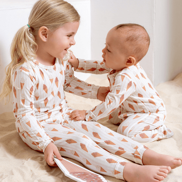 Baby footie zippered one piece in Sundae Fun Day design, showcasing playful colors and cozy fit. Angle 3 view.