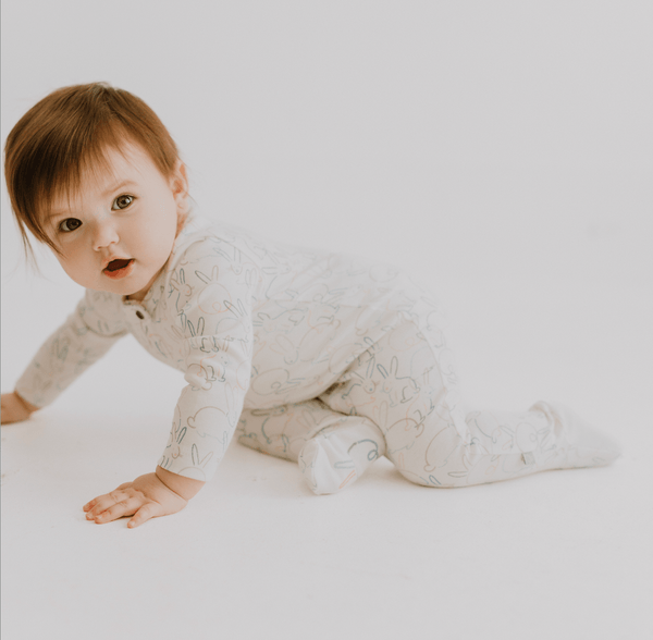 Soft baby footie with adorable bunny print, perfect for cozy comfort in one-piece style.