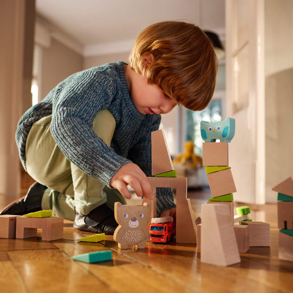Colorful Forest Friends Stacking Toy for babies, showcasing playful animal designs from an angled view.