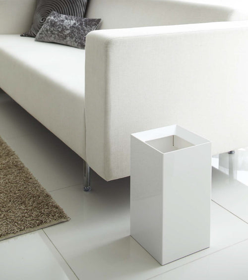 Stylish baby trash can at an angle, perfect for nursery organization and waste disposal.