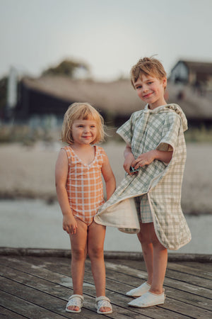 Sweetheart 1 Piece Swimsuit in Buckwheat Plaid, UPF protected, eco-friendly fabric, angle view.