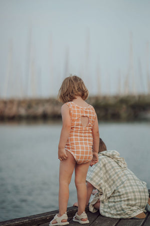 Sweetheart 1 Piece Swimsuit in Buckwheat Plaid, UPF protected, eco-friendly design for babies. Angle 8 view.