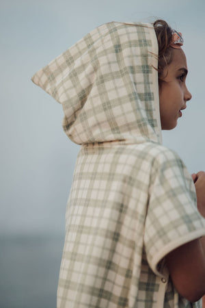 Organic cotton baby bathing towel poncho in fern plaid, angle view showcasing soft, eco-friendly design.