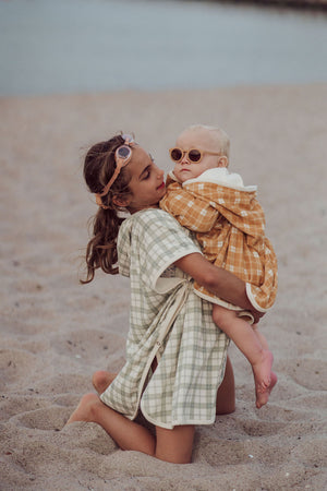 Organic cotton bathing towel poncho in fern plaid, perfect for babies after bath time. Angle 5 view.
