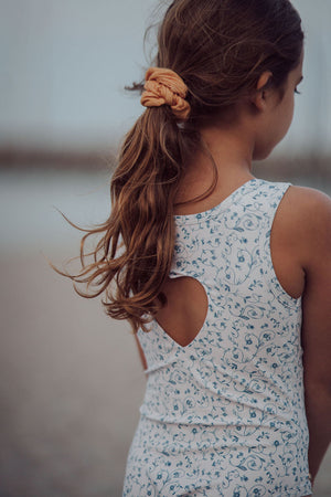 Sweetheart 1 Piece Swimsuit in Scandi Floral, UPF protection, eco-friendly design, angle view. Perfect for baby swimwear.