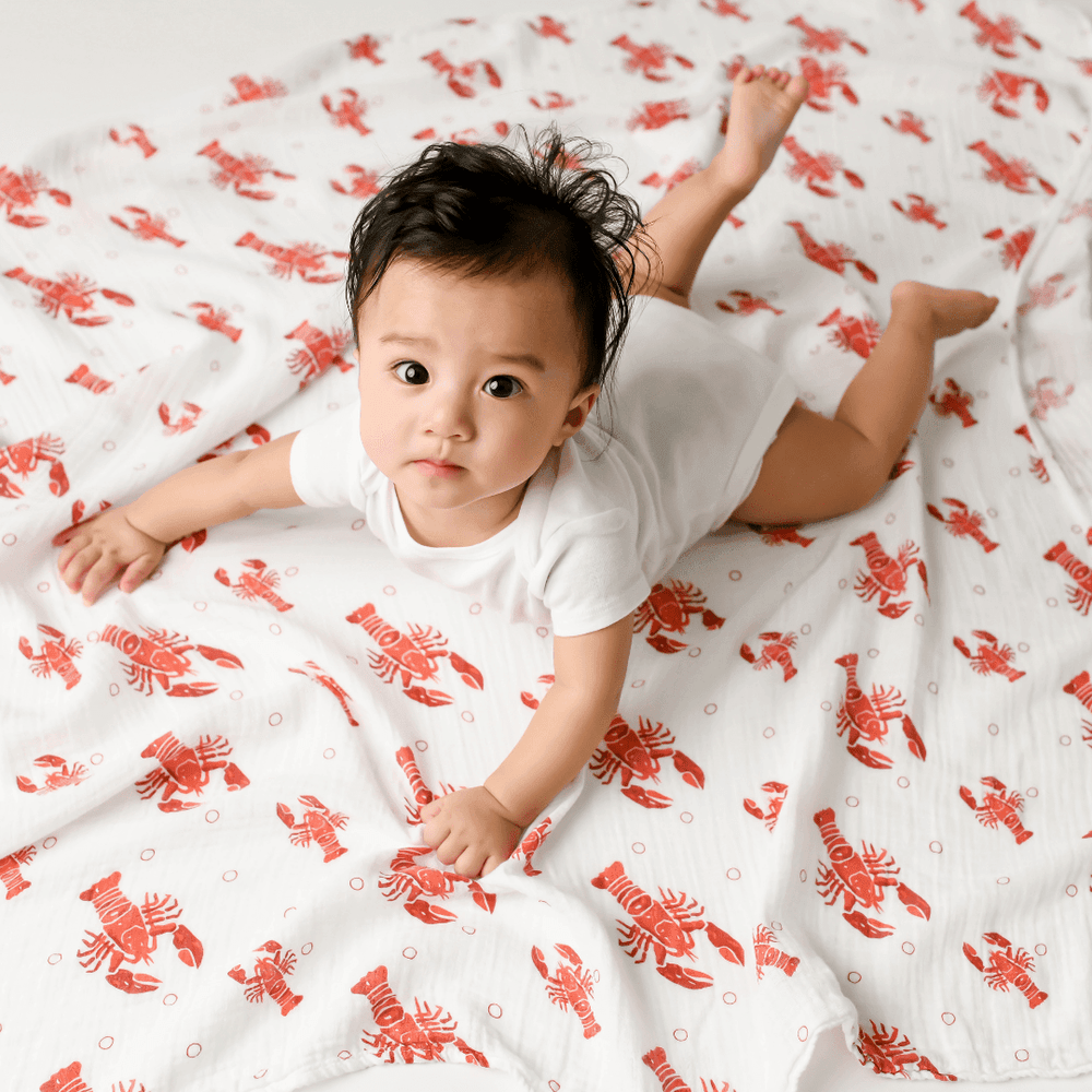 Baby gift set featuring Heads Tails crawfish lobster muslin swaddle blanket and burp cloth/bib combo.