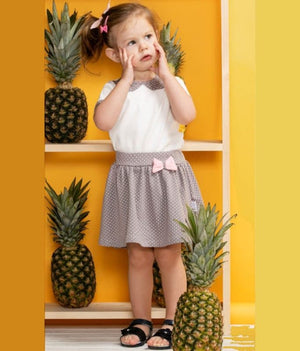 Girls summer skirt in vibrant colors, displayed at an angle to showcase its playful design and lightweight fabric.