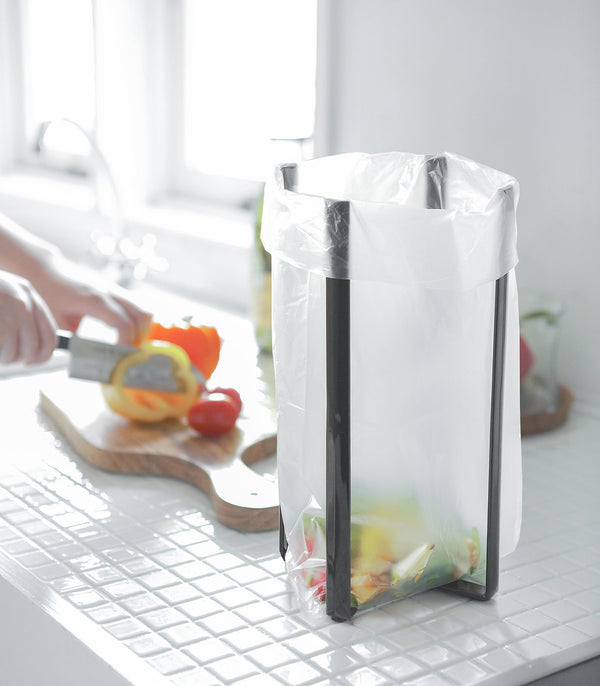 Collapsible steel bottle dryer at angle 12, perfect for efficient drying of baby bottles and accessories.
