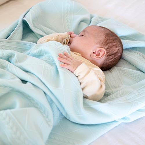 Mint knit baby blanket, soft and cozy, perfect for keeping your little one warm and stylish.