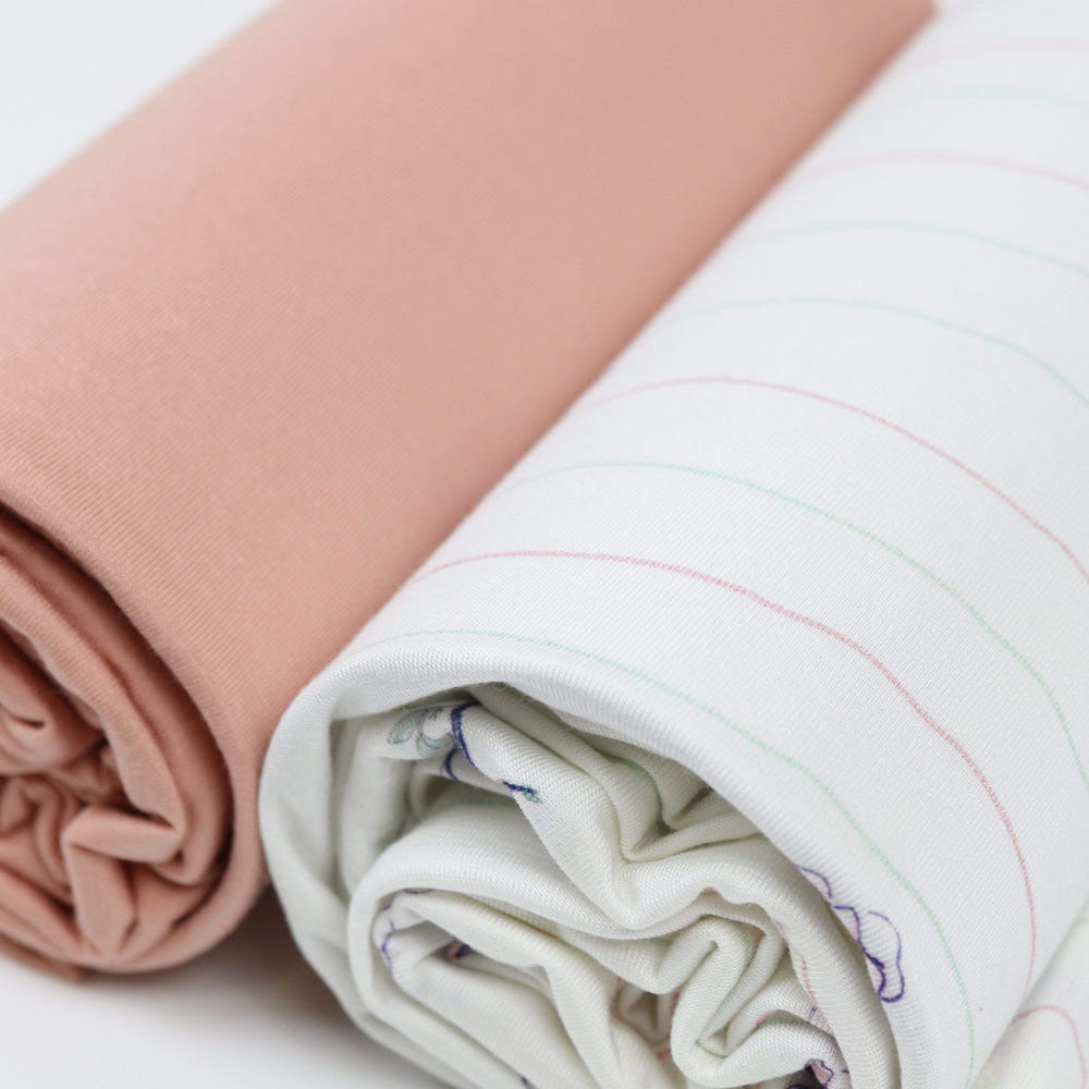 Flower and pink 2-pack swaddle blankets for babies, soft and cozy for comfortable sleep.