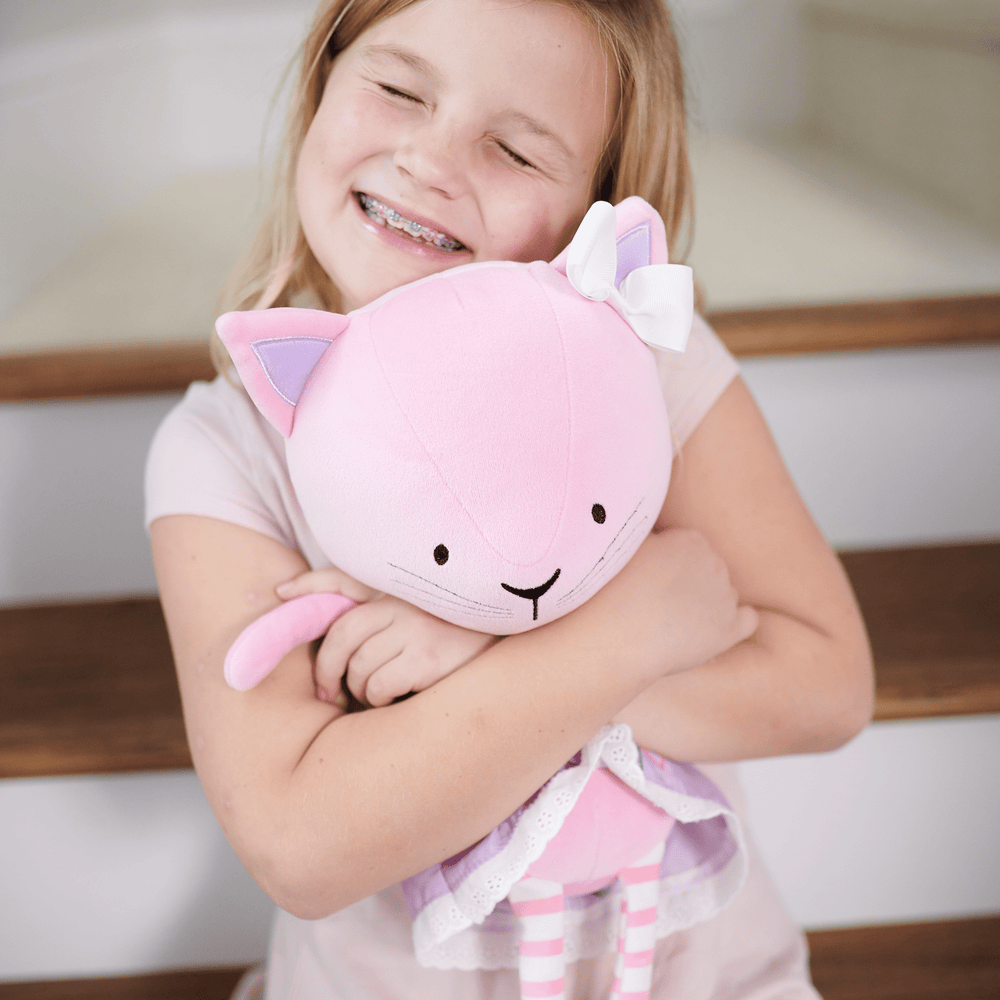 Lucy Kitty Plush Doll in a cute dress, perfect for cuddles and playtime. Ideal gift for babies and toddlers.