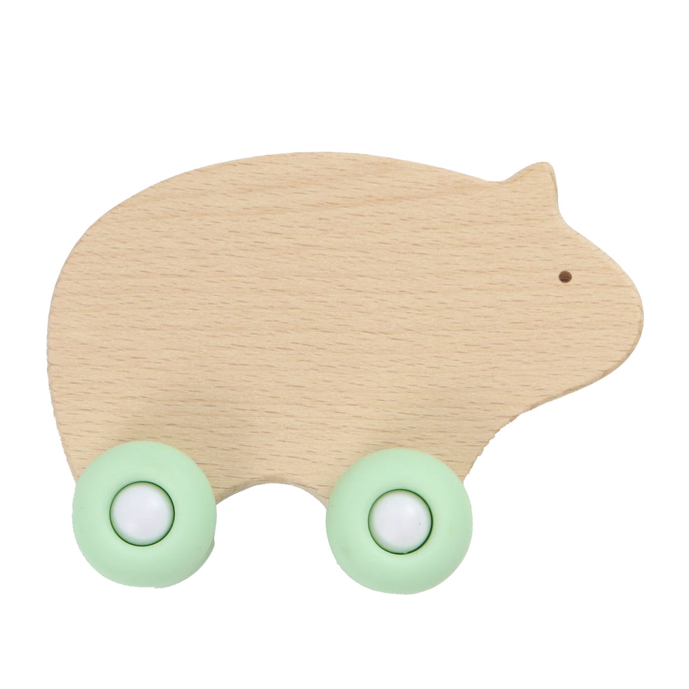 Silicone and wood teether with wheels in three colors, perfect for soothing baby's gums.