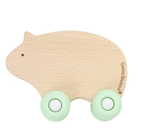 Silicone and wood teether with wheels in three colors, perfect for soothing baby's gums.