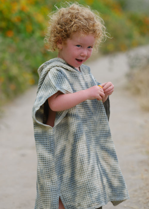 Hand-dyed Shwally poncho for babies, cozy and stylish, perfect for swaddling and keeping warm.