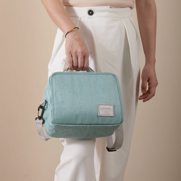 Stylish diaper changing bag at angle 11, perfect for on-the-go parents.