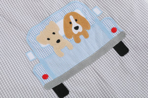 Grey gingham puppies in truck shortalls for babies, angle view showcasing adorable design and comfortable fit.