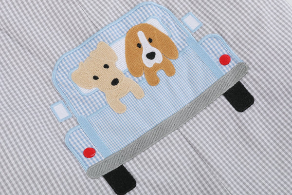 Grey gingham puppies in truck shortalls for babies, angle view showcasing adorable design and comfortable fit.