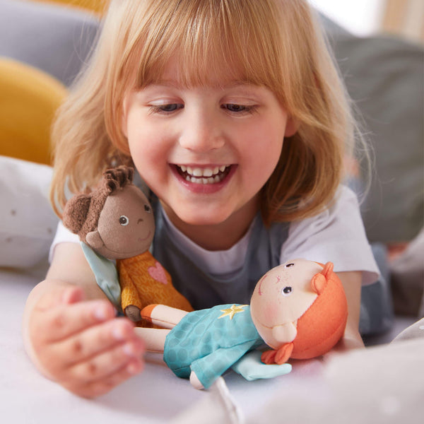 Guardian Angel Mini Doll Nora in plush fabric, perfect for cuddly comfort and imaginative play for babies.