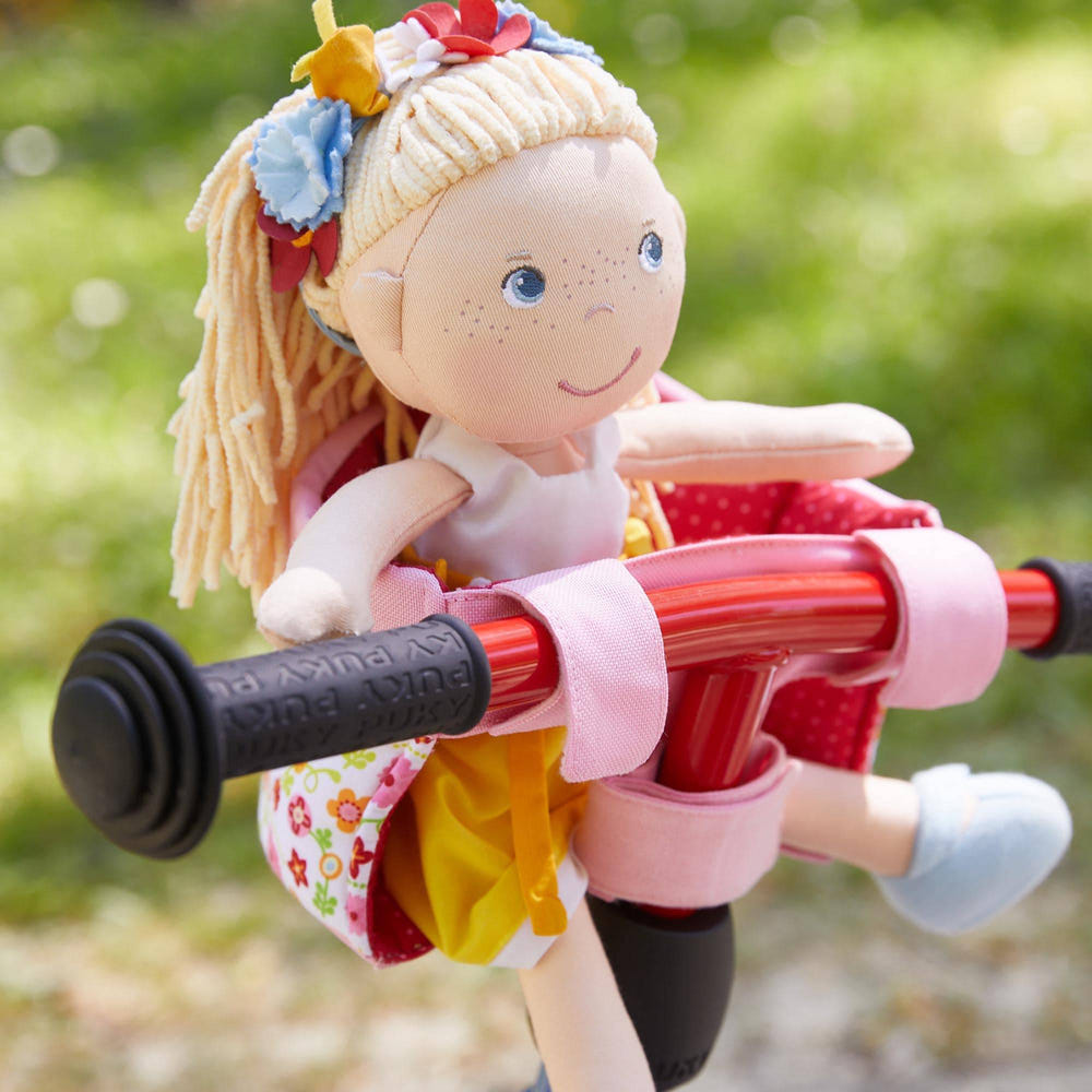 Soft Doll's Bike Seat in Flower Meadow design, perfect accessory for imaginative play and adventures.