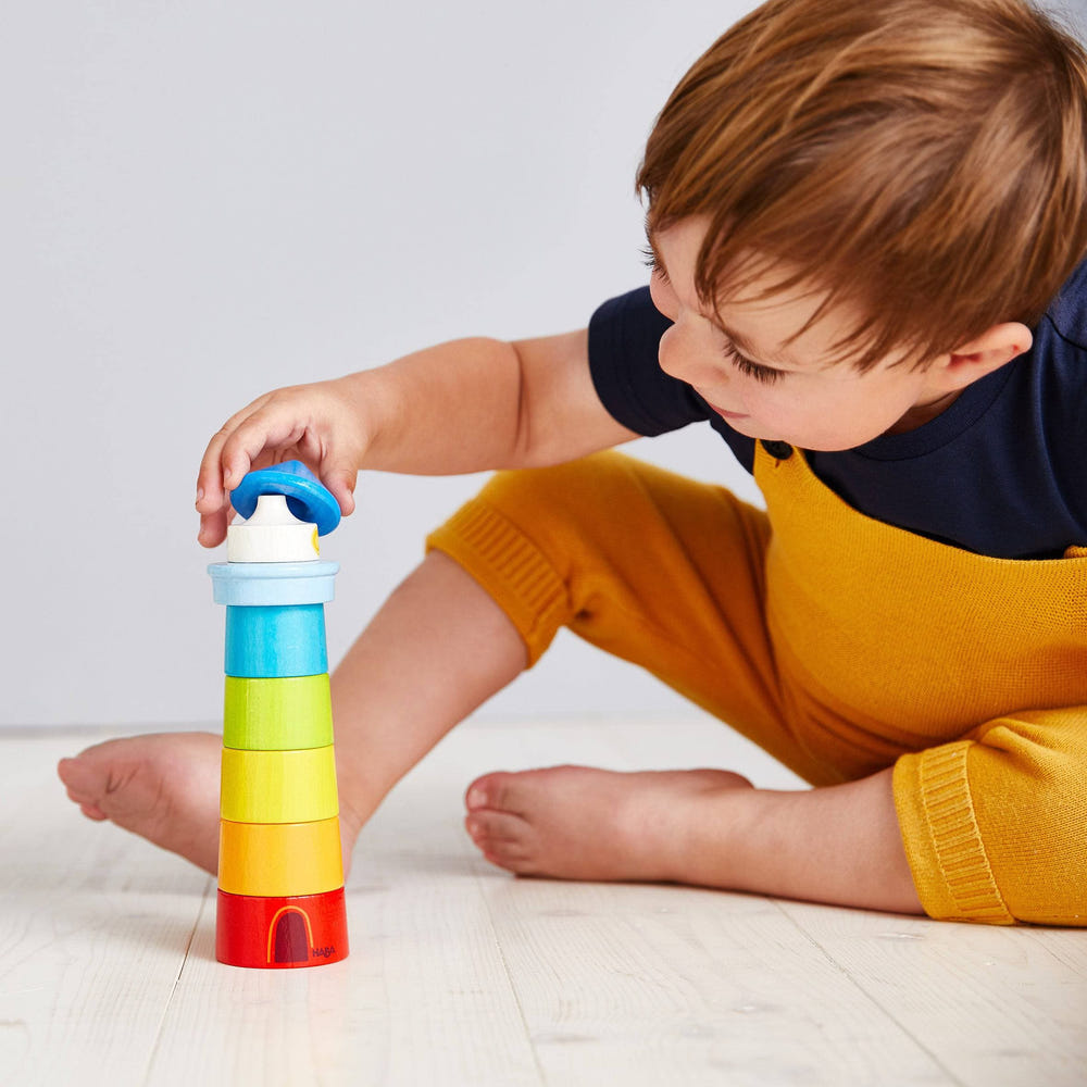Lighthouse Wooden Rainbow Stacker - colorful wooden toy for stacking and sorting, perfect for early childhood development.
