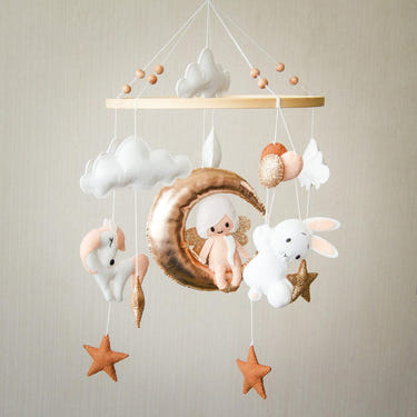 Handmade baby mobile "Dream" for imaginative play, featuring whimsical designs and soothing colors for nursery decor.