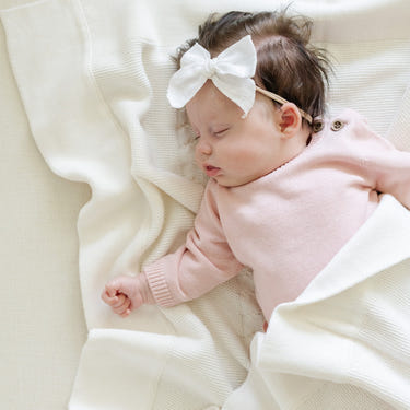 Heirloom cotton knit receiving blankets for babies, soft and cozy swaddles in a stylish design.