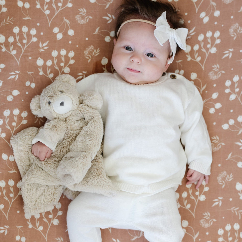 Heirloom cotton knit two-piece baby set in soft colors, perfect for comfort and style.