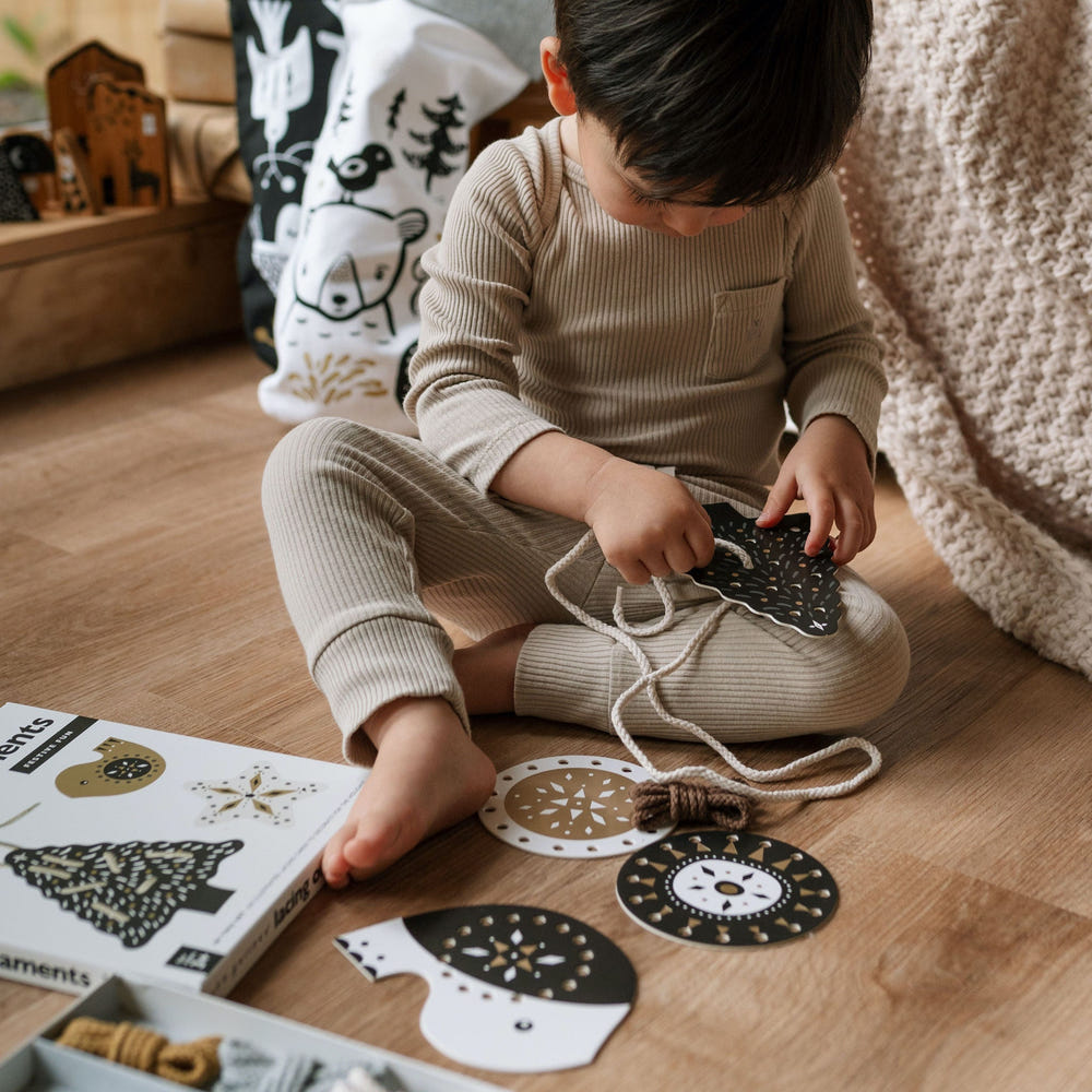 "Festive Fun Lacing Ornaments for kids - Christmas crafting activity for holiday creativity and fun."