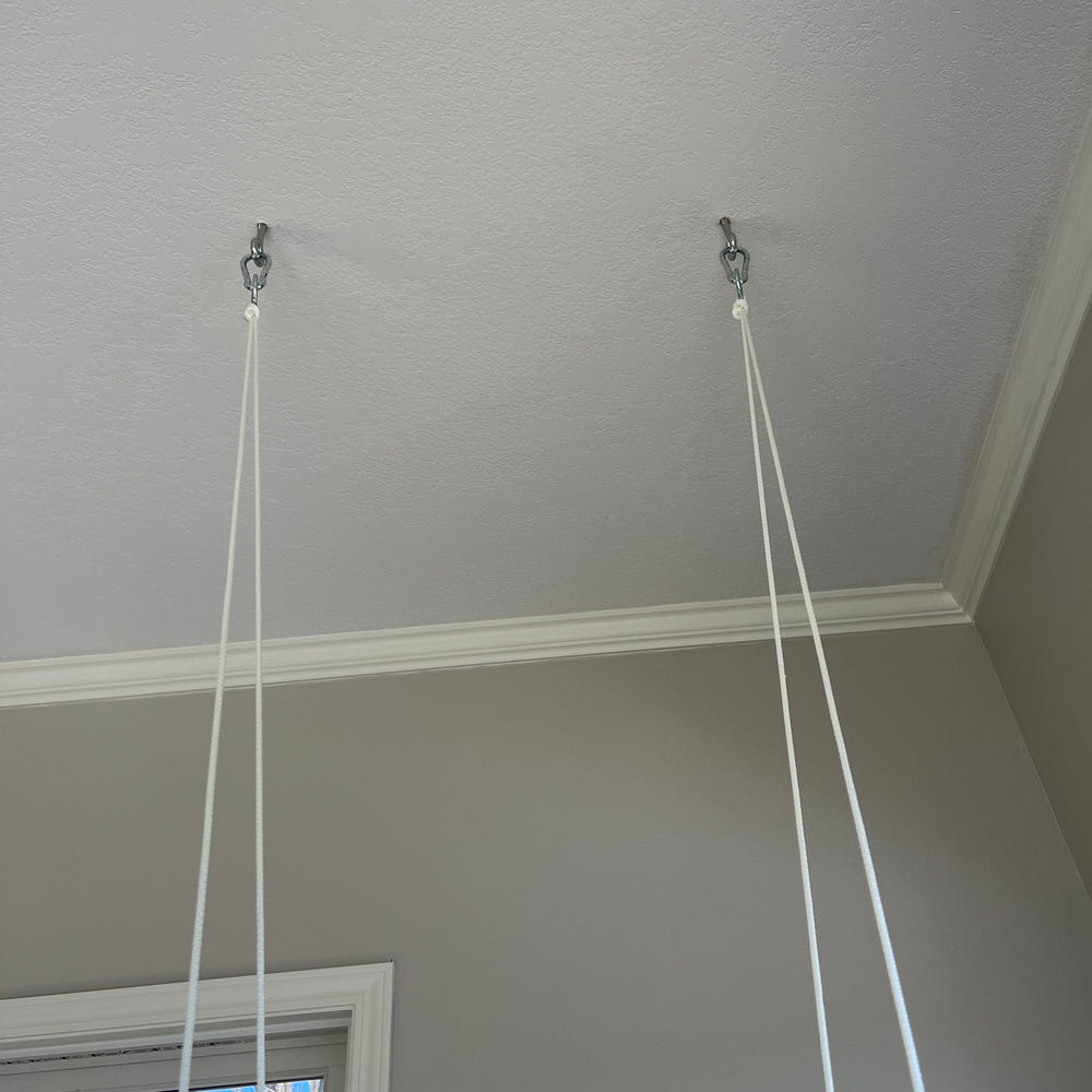 Gray indoor baby swing for comfortable and safe playtime.