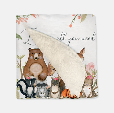 Vintage baby blanket with "Love Is All You Need" design, perfect for keeping your little one cozy and stylish.