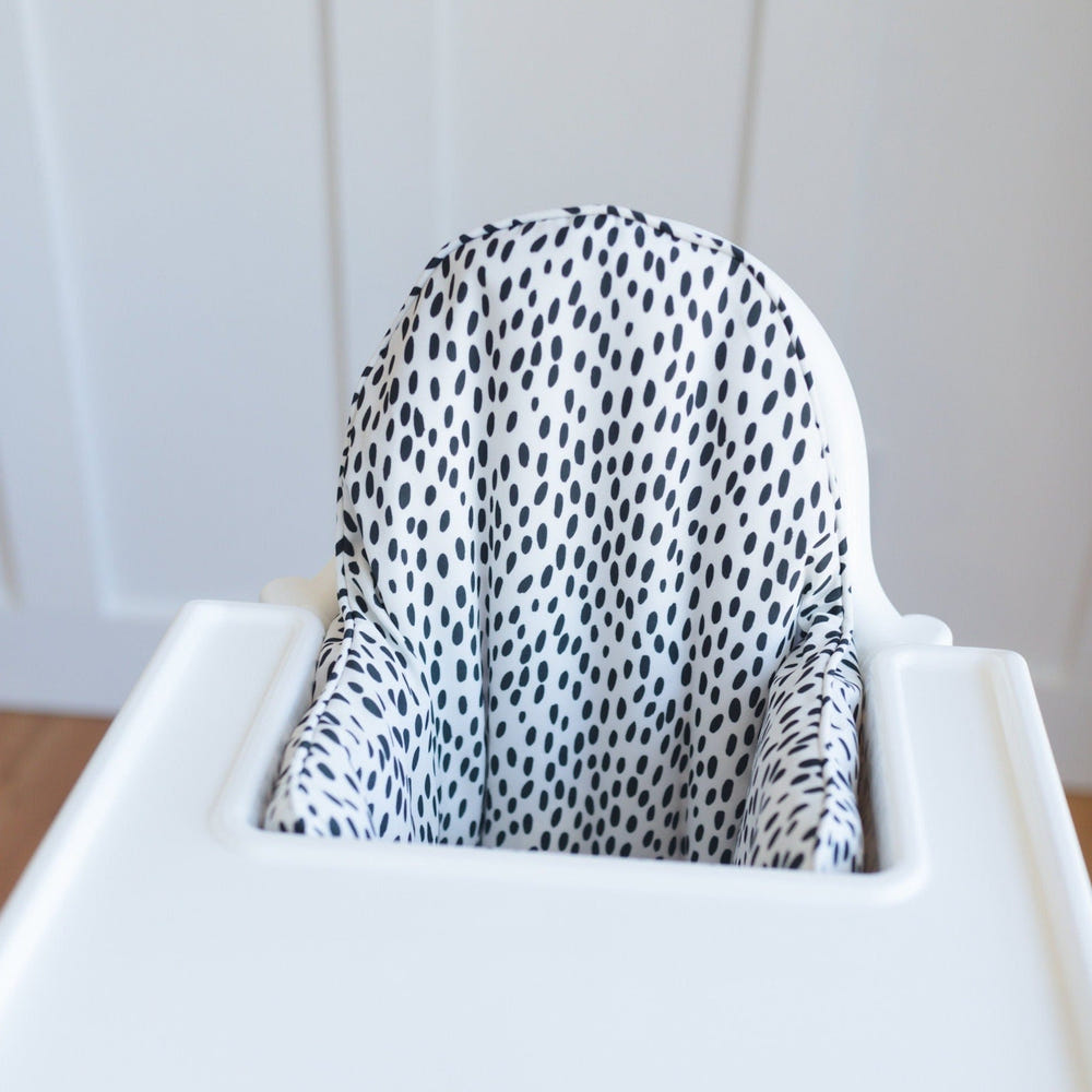 White & black dots IKEA Antilop cushion cover for baby seat, stylish and comfortable accessory for infants.