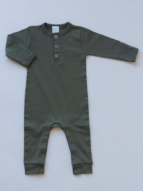 Organic cotton henley romper for babies, angle view showcasing soft fabric and stylish design.