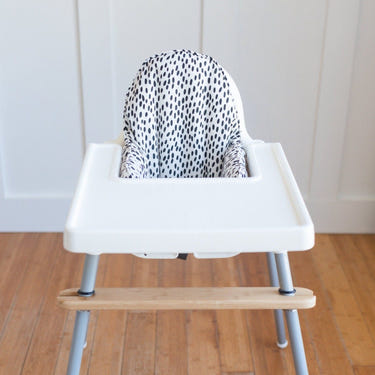 White & black dots IKEA Antilop cushion cover for baby seat, stylish and comfortable accessory for infants.
