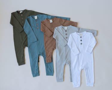Organic Cotton Henley Romper for babies - soft, breathable, and stylish clothing for your little one.