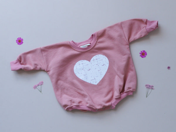 Distressed Heart Sweatshirt Romper in various colors, angle view 4, perfect for stylish baby outfits.