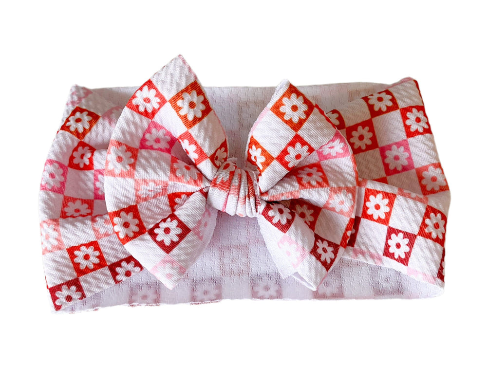 Ombre checkers and flowers headwrap bow for babies, perfect accessory for hats, socks, and mittens collection.