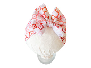 Ombre checkers and flowers headwrap bow for babies, perfect accessory for hats, socks, and mittens collection.