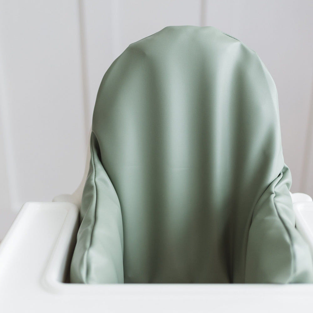 Sage green vegan leather IKEA Antilop cushion cover for baby seat, stylish and comfortable accessory.